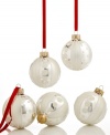 As bright as snow, Martha Stewart Collection Christmas ornaments will be an annual favorite in glass that's striped and spotted with frosty white glitter.