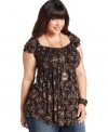 Be a top style pick in American Rag's cap-sleeve plus size top, featuring a sweet floral-print.