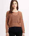 Downtown-cool sweater in a cropped, open-knit silhouette with ribbed trim and lots of swagger. RoundneckDropped shouldersLong dolman sleevesRibbed cuffs and hemAbout 20 from shoulder to hemAcrylicHand washImportedModel shown is 5'11 (178cm) wearing US size Small.