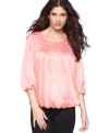 Puckered pleats add a textural touch to this flowy Alfani top -- perfect over your spring skinny jeans!