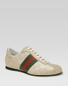 Lace-up sneaker in guccissima leather with signature web. Rubber sole Made in Italy