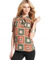 A bold graphic print and chic tie-neck detail are marvelously mod touches on Vince Camuto's latest blouse.