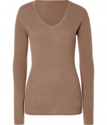 Elegant and ultra-flattering, this sumptuous cashmere pullover from Dear Cashmere is guaranteed to be a new-season staple - V-neck, long sleeves, slim fit, long body, rhinestone logo at hem - Pair with skinny jeans, a chunky cardigan, and high heel booties