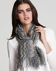 This oversized Missoni scarf is sheer with pops of sparkle, thanks to metallic silver threads woven throughout the signature zig-zag print. This oversized Missoni scarf is sheer with pops of sparkle, thanks to metallic silver threads woven throughout the signature zig-zag print.