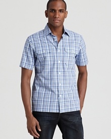 The calm plaid pattern on this double-pocket button-down puts you at ease in your casual cool look. The calm plaid pattern on this double-pocket button-down puts you at ease in your casual cool look.