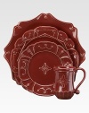 Festooned with ruby garlands, this graceful scalloped ceramic bowl brings a splash of understated elegance to your table.Stoneware ceramicDishwasher safeImported