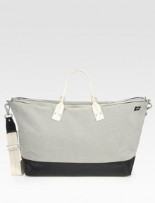 Start packing all of your essentials for your weekend getaway with this roomy, canvas field duffel trimmed in sleek leather.Zip closureDouble top handlesAdjustable shoulder strapExterior, interior zip pocketsCanvas15W x 20H x 9DImported Start packing all of your essentials for your weekend getaway with this roomy, canvas field duffel trimmed in sleek leather.Zip closureDouble top handlesAdjustable shoulder strapExterior, interior zip pocketsCanvas15W x 20H x 9DImported