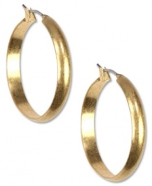 Amp up your jewelry box with these hoops from Jones New York. Finished with a wide design and a click top. Crafted from worn gold tone mixed metal. Approximate drop: 1-1/4 inches.