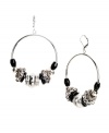 Gypsy chic. These bohemian-style Nine West hoops feature a beaded design with plastic jet beads and silver tone and hematite tone mixed metal accents. Approximate drop: 2 inches. Approximate diameter: 1-3/4 inches.