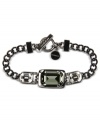 Be the focus of attention in Givenchy's stunning flex bracelet. Crystal stone and black diamond accents set the state for true glam. Crafted in light hematite tone mixed metal. Approximate length: 7-1/4 inches.