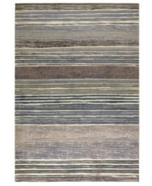 Variegated tones of bone, tan, silver, teal and sage are interwoven across this Taylor Vibrato area rug from Couristan, creating the ultimate floor accent for complementing industrial and mid-century decors. Wilton-woven for unparalleled depth, texture and quality. Variegated tones of bone, tan, silver, teal and sage are interwoven across this Taylor Vibrato area rug from Couristan, creating the ultimate floor accent for complementing industrial and mid-century decors. Wilton-woven for unparalleled depth, texture and quality.