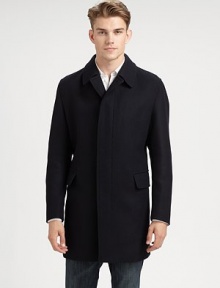 Classic balmacaan styling in a water-resistant wool crepe, a tailored all-weather staple.Notched-collarButton frontFlap pocketsAbout 36 from shoulder to hem95% wool/5% nylonDry cleanImported