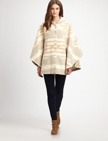 Inspired by Midwestern textiles, this slouchy poncho style will keep you cozy all season long.HoodDropped shouldersOpen sleevesConcealed button frontAbout 30 from shoulder to hem82% wool/18% cottonDry cleanMade in USAPlease note: one size fits all.This style runs true to size. We recommend ordering your usual size for a standard fit. 