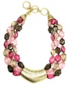 The perfect palette of color. Jones New York's stunning three-row style features plastic beads in brown, taupe, hot pink and pale pink hues. A gold-plated toggle clasp and v-shaped pendant complete the look. Approximate length: 17 inches + 2-inch extender. Approximate drop: 1 inch.