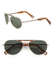 A double-bridge design handcrafted in a smaller, unisex style from hypo-allergenic nickel-plated alloy. Logo temple detail Mineral glass lenses 100% UV protective Imported A double-bridge design handcrafted in a smaller, unisex style from hypo-allergenic nickel-plated alloy. Logo temple detail Mineral glass lenses 100% UV protective Imported