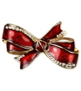 Put a bow on your new look. This festive box pin from Jones New York is styled in an bow design and is embellished with shimmering plastic stones. Crafted in gold tone mixed metal. Approximate length: 2 inches. Approximate width: 1-1/4 inches. Includes gift box.