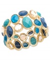 Cool off in a mixture of blue hues. Charter Club's trendy cuff bracelet is adorned with sparkling and matte epoxy beads in a range of blues from turquoise to cobalt. Crafted in gold tone mixed metal. Bracelet stretches to fit wrist. Approximate diameter: 2-1/2 inches.