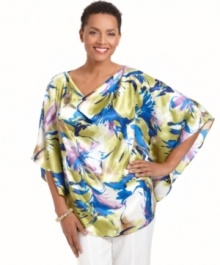 An elegant poncho silhouette gets revamped for spring with a vibrant floral print and sophisticated cowl neckline in this J Jones New York look.