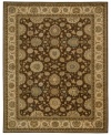 Floral medallions connected by a complex labyrinth of vines distinguish the well-composed design of this rug. Machine woven from the highest quality wool and meticulously dyed for a richly varied color palette to bring a unique accent of luxury to the home.