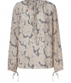 Lovely sand and navy floral top from Joseph - This boho-chic blouse features a lovely floral print and an on-trend billowy shape - Tie neck and tie sleeve details and oversized shape - Pair with high-waisted flared jeans, stacked heel boots, and a military-inspired jacket