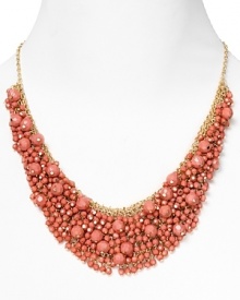 Brighten up every outfit with this layered beaded bib necklace from Cara accented by a dramatic collar of coral stones. Brighten up every outfit with this layered beaded bib necklace from Cara accented by a dramatic collar of coral stones.