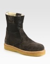 Elegant suede design, with contrasting rubber sole and cozy shearling lining.Leather upperRubber soleMade in Italy