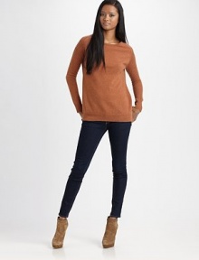 Sassy wool crewneck with semi-sheer, open-stitch sleeves and a split hem. Ribbed crewneckLong open-knit sleevesRibbed cuffsRibbed split hemWoolDry cleanImported