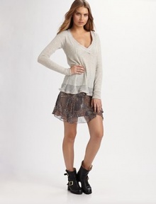 Semi-sheer v-neck with long sleeves and allover ribbing. V-neck Long sleeves Longer length hits below the hips 50% nylon/40% alpaca/10% merino wool Dry clean ImportedModel shown is 5'9½ (176cm) wearing US size Small. Semi-sheer v-neck with long sleeves and allover ribbing. V-neck Long sleeves Longer length hits below the hips 50% nylon/40% alpaca/10% merino wool Dry clean ImportedModel shown is 5'9½ (176cm) wearing US size Small.