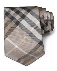 A signature check print tie from Burberry London, rendered in luxurious Italian silk for a stunning look and touch. A signature check print tie from Burberry London, rendered in luxurious Italian silk for a stunning look and touch.