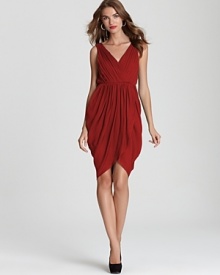 Opt for drama in this Alice + Olivia draped dress with deep v back. An asymmetric skirt lends more modernity for high impact fashion. Opt for drama in this Alice + Olivia draped dress with deep v back. An asymmetric skirt lends more modernity for high impact fashion.