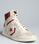 A retro-cool high top from Converse by John Varvatos, fully distressed for an authentic look on and off the court.
