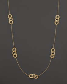 Hammered 18K yellow gold stations decorate a delicate chain on this timeless Roberto Coin necklace.