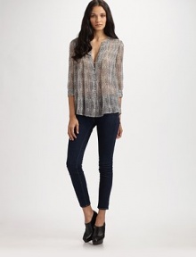 Airy, semi-sheer v-neck in pure silk. V-neck Button front Three-quarter sleeves Silk Dry clean Imported Airy, semi-sheer v-neck in pure silk. V-neck Button front Three-quarter sleeves Silk Dry clean Imported