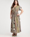 A spellbinding maxi dress featuring a vivacious print. The impeccably designed neckline will complement your decolletage as its Empire waist defines your shape.V-necklineShort sleevesEmpire waistAllover printConcealed back zipper About 43 from natural hem94% venezia/6% spandexDry cleanMade in USA