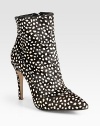 Finished with an abstract polka-dot print and exposed side zipper, this calf hair ankle boot has a substantial heel and point toe. Self-covered heel, 4 (100mm)Printed calf hair upperSide zipperLeather lining and solePadded insoleImportedOUR FIT MODEL RECOMMENDS ordering one half size up as this style runs small. 