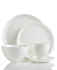 Echoing the feel of hand-thrown pottery, the contemporary Spin 5-piece place settings from Sasaki's collection of white dinnerware boasts a subtle spun etching, giving each piece its distinctive character. Echoing the feel of hand-thrown pottery, the contemporary Spin 5-piece place settings from Sasaki's collection of white dinnerware boasts a subtle spun etching, giving each piece its distinctive character.