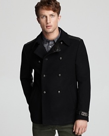 Skull detail on the buttons and leather trim give this peacoat a bit of edge, but the fine blend of materials is rounded out with cashmere for a softer finish. Skull detail on the buttons and leather trim give this peacoat a bit of edge, but the fine blend of materials is rounded out with cashmere for a softer finish.