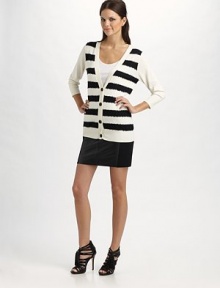 A luxe blend of cotton and cashmere, finished with bold, sequined stripes.V neckline Three-quarter sleeves Button-front placket Ribbed trim 85% cotton/15% cashmere Dry clean Imported A luxe blend of cotton and cashmere, finished with bold, sequined stripes.V neckline Three-quarter sleeves Button-front placket Ribbed trim 85% cotton/15% cashmere Dry clean Imported