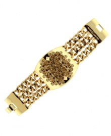 An edgy effect. Stud embellishments add attitude to this chic multi chain bracelet from Vince Camuto. Also adorned with glittering glass accents in a topaz hue, it's crafted in gold tone mixed metal. Approximate length: 8 inches.