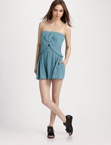 A contemporary take on the romper silhouette, finished a chic crossover overlay and flared shorts.Strapless Overlay with tulip hem Elastic waistband Concealed size zipper Inseam, about 3 79% viscose/21% nylon Dry clean Imported