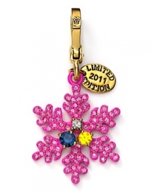 Charm them. Juicy Couture's playful snowflake token is uniquely chic.