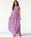 BCBGMAXAZRIA's latest gown is mesmerizing with its pleated bust, ribbon empire waistband and graceful, flowing fit. It's a flawless pick as a bridesmaid dress, prom dress and for other formal occasions.