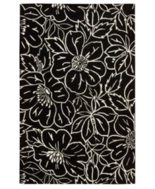 Striking ivory outlines render a high-style floral motif that pops against a jet-black ground. This Nourison rug is hand-tufted from premium-quality wool and meticulously hand-carved for a lush dimensional effect, every detail coming together to create a bold focal point in any setting.