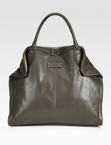 A roomy carryall with a sleek design in supple leather.Double top handles, 6 dropTop zip closureMagnetic fold-down cornersOne inside zip pocketCotton lining18W X 16H X 4½DMade in Italy A roomy carryall with a sleek design in supple leather.Double top handles, 6 dropTop zip closureMagnetic fold-down cornersOne inside zip pocketCotton lining18W X 16H X 4½DMade in Italy