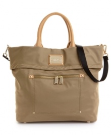 Ready for your next impromptu getaway, this travel-ready tote from Calvin Klein stores all your necessities in oh-so chic style. Polished goldtone hardware and a sleek signature plaque add head turning appeal to this adventure seeking design. Ready for your next impromptu getaway, this travel-ready tote from Calvin Klein stores all your necessities in oh-so chic style. Polished goldtone hardware and a sleek signature plaque add head turning appeal to this adventure seeking design.