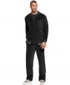 Made from soft fleece, this velour track suit by Sean John will have you chilling in serious style.