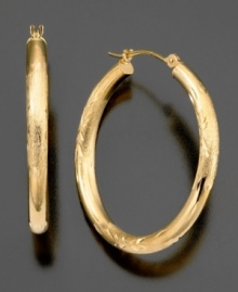 A touch of shine, a swirl of engraving, these beautiful 14k gold hoop earrings have all the right elements. Approximate diameter: 1 inch. A touch of shine, a swirl of engraving, these beautiful 14k gold hoop earrings have all the right elements. Approximate diameter: 1 inch.