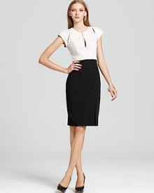 Sleek cut-outs make a unique statement on this seductress-meets-sophisticate dress from Black Halo.