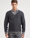 A well-knitted wool pullover sweater is printed in a textural, geometric pattern for a look that exudes modern elegance.V-neckRibbed knit cuffs and hemWoolMachine washImported