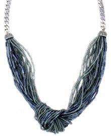 Calm down in cool hues. Jessica Simpson's chic knotted necklace combines multiple strands of acrylic beads in a palette of pale blue and grey. Set in silver tone mixed metal. Approximate length: 17 inches. Calm down in cool hues. Jessica Simpson's chic knotted necklace combines multiple strands of acrylic beads in a palette of pale blue and grey. Set in silver tone mixed metal. Approximate length: 17 inches.